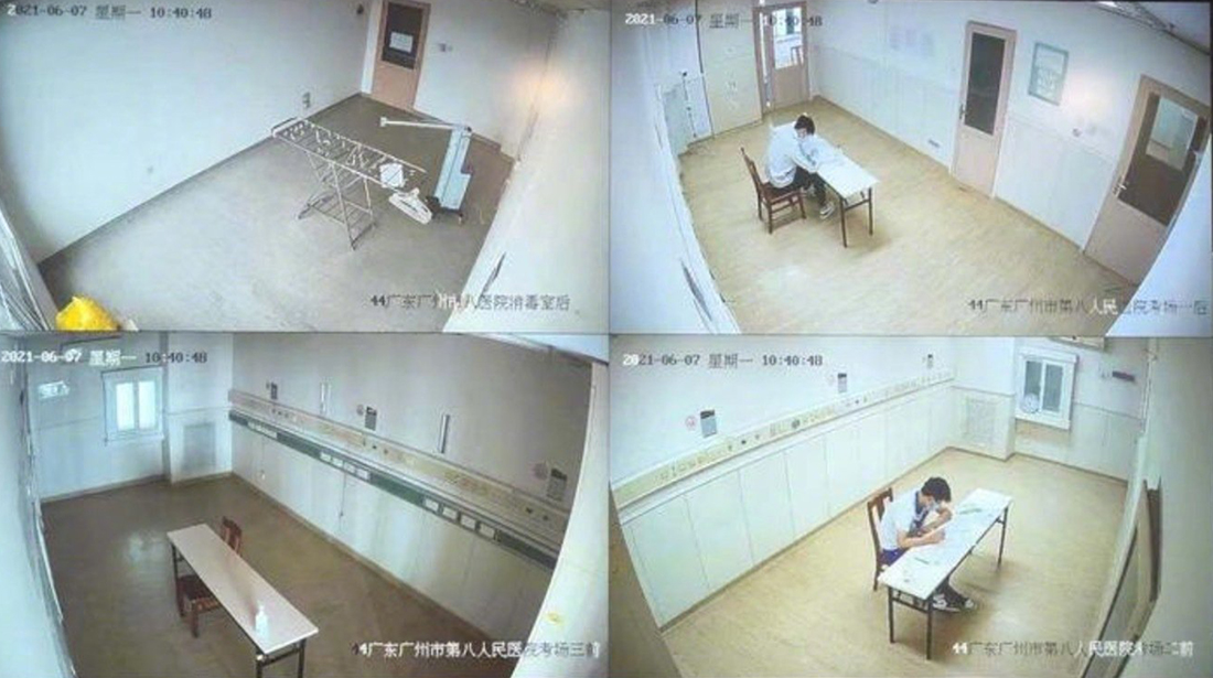 2021年6月7日，广州，在广州医科大学附属市八医院，两名新冠肺炎确诊考生参加语文科目的高考。考场按照一人一间单独房间配置，8名专职人员全方位监考。监控视频截图