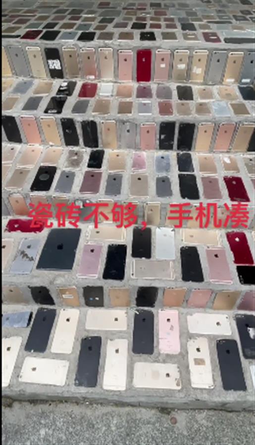 青岛店主回应“数百台苹果手机砌台阶”：成“打卡地”后并未带来多少生意